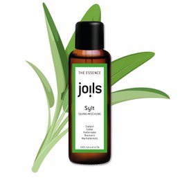 A 100ml bottle of Sauna infusion SYLT essential oil. The bottle has a black label with the brand name "joils" and the product name "Sylt" displayed. The bottle is surrounded by green leaves, indicating the natural, botanical nature of the product.