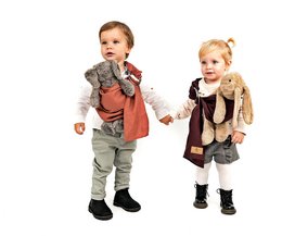 Soft, adjustable mini ring sling in ocean, flax, and ash colors for carrying infants and toddlers.