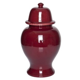 Tall, round, red ceramic vase with a lid.