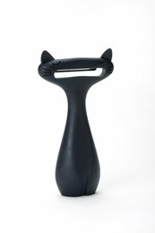A black and white cat-shaped vegetable peeler with a curved handle for comfortable grip. Ideal for peeling potatoes, carrots, and other vegetables with ease.