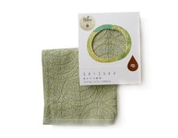 Green handkerchief-style pocket towel made from natural dyed cabbage material.