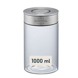  A 1 liter clear glass storage jar with a silver metal lid. The jar is cylindrical in shape and can be used to store various dry goods or ingredients.