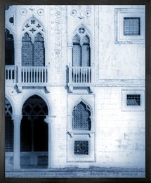 Framed vintage-style canvas print featuring a detailed architectural facade with ornate Gothic-style windows and arches.