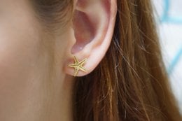 Gold plated starfish stud earrings, ocean-inspired jewelry with a delicate, minimalist design.