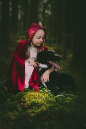 A red hooded cape with a floral pattern, perfect for a Little Red Riding Hood costume for kids.