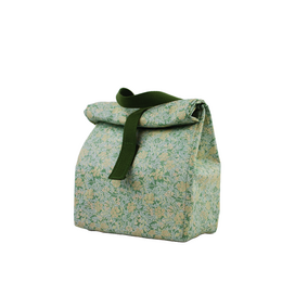 A green and blue floral patterned lunch bag with a strap closure.