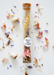  Biodegradable seed confetti tube with dried flowers and petals, eco-friendly wedding celebration scatter.