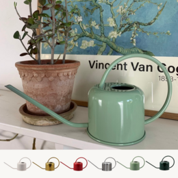 A 0.9L watering can in cream, glossy brass, red, stainless, summer green, and green colors. The can has a classic, simple design suitable for indoor and outdoor use in gardening and plant care.