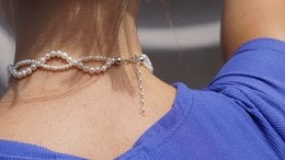 A delicate pearl helix necklace with a twisted chain design.