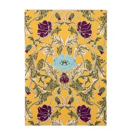 A yellow notebook with a floral pattern featuring purple flowers and green leaves on the cover.