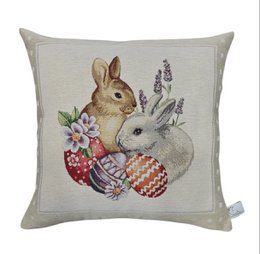  Decorative cushion cover featuring two rabbits surrounded by Easter eggs and flowers. The cushion cover is made of gobelin fabric and features a colorful, intricate design.