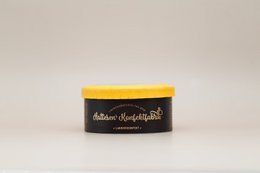 Orange box containing licorice candies in various shapes and colors.