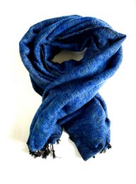 A large, rectangular blue scarf made of soft, handwoven yak wool. The scarf measures 190 x 75 cm and has a shawl-like appearance with fringed edges.