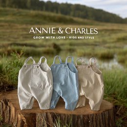 Organic cotton baby rompers in blue, yellow, and cream colors. Available in sizes 3-6M, 6-12M, 12-18M, and 18-24M.