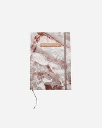 Luxurious yashma diary notebook with gold foil accents, featuring a soft, textured cover in neutral tones.