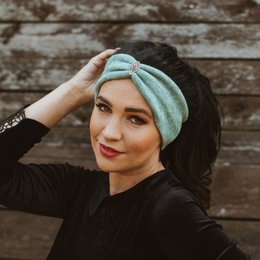 Light ice green headband with adjustable size for small to standard head circumference.