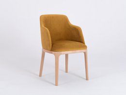 A red upholstered dining chair with a curved backrest and wooden legs. The chair has a modern, minimalist design and would be suitable for a dining room or kitchen setting.