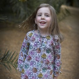 Colorful floral print blouse for kids, featuring a variety of vibrant patterns and designs. Made from soft, comfortable material suitable for everyday wear.