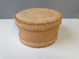 Oval-shaped wooden bread box with decorative stitching around the edges. Suitable for storing bread and other baked goods.