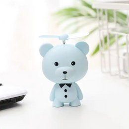 Cute, rechargeable bear-shaped air cooler fan in green and pink colors, suitable for kids' rooms and night lights.
