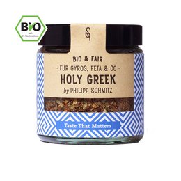 Organic Holy Greek spice blend in a glass jar with a blue and white patterned label. The spice blend contains a variety of herbs and seasonings.