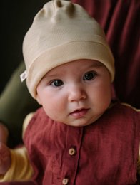 Soft, warm merino wool baby hat in natural color.