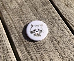 Decorative fridge magnet with a cute raccoon illustration in watercolor style.