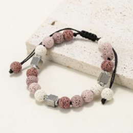  Natural lava stone round bead bracelet in pink shades. Handmade beaded bracelet with tinted lava stones.