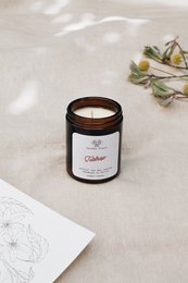 A tall, round candle with a tuberose scent, available in 120ml, 180ml, and 500ml sizes.