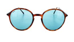 Round, tortoiseshell-style sunglasses with light blue lenses.
