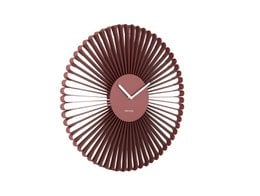 Burgundy red wall clock with oval sunburst design, modern minimalist style, metal radiating spokes.