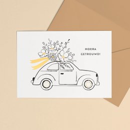 A6 gold foil wedding card with a whimsical illustration of a car with flowers on top, indicating a celebratory and festive design suitable for wedding invitations or announcements.