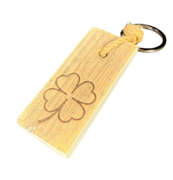  Wooden key hanger with 4-leaf clover design, suitable for holding keys or other small items.