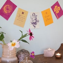 A colorful banner with flags and an illustration of a woman, featuring the text "Wishing flag | Happiness" in multiple languages.
The image shows a decorative banner or garland with several colorful flags or banners. The flags are in shades of pink, orange, and yellow. The central element is an illustration of a woman, possibly a fairy or mythical figure, with flowing hair and an ornate design. The text on the flags includes "Wishing flag | Happiness" in English, Dutch, German, and French.
This product appears to be a decorative item, likely intended as a gift or home decor, featuring a whimsical, illustrated design and multilingual text related to wishes and happiness.