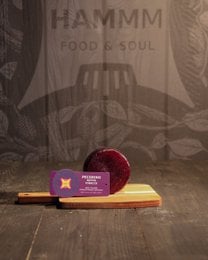 "Artisanal Italian sheep's cheese, wine-aged, creamy pale interior, deep burgundy wine-coated rind, gourmet"