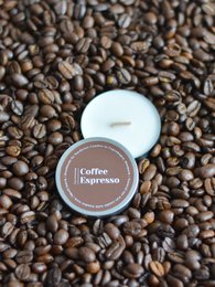  Espresso-scented soy candle with a round, compact shape.