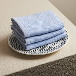 Cobalt blue cotton hammam terry face towel, soft textured fabric, rolled presentation