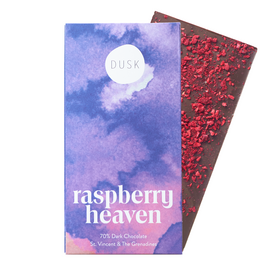 Raspberry heaven is a dark chocolate bar with a vegan, single origin, gluten-free, and palm oil-free recipe. The product features a purple and white cloud-like design on the packaging.