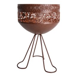 A decorative solar light with a metal base and a round, patterned shade. The light is designed for outdoor use and provides ambient lighting.