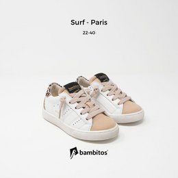 Casual sneakers with a zipper on the inside, featuring a white and beige color scheme, suitable for kids' sports activities.