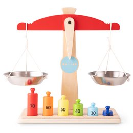 A wooden balance scale toy with colorful weights and metal pans. The scale is designed to teach children about weight and balance.