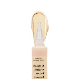 A concealer product with a glass bottle and applicator wand. The product is labeled "The Most Concealer" and appears to be a face makeup item.