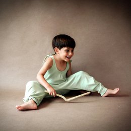  Cotton jumpsuit for kids in various colors including green, cinnamon, and acorn. Features a relaxed, comfortable fit and simple design suitable for everyday wear.
