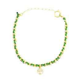  A large, gold-toned mesh necklace with green and orange beads. The necklace features a charm or pendant in the shape of a clover or four-leaf clover.