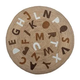 A round jute rug with a pattern of brown and beige letters and shapes.