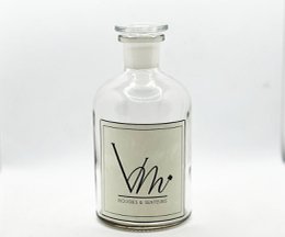 White glass diffuser bottle with 500ML capacity, available in various fragrance variants including Sapin Magique, Joie de Noël, Douceur Coton, and others.