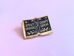  Gold plated hard enamel pin with a cat astronaut design. Suitable for wearing as a brooch.