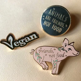 Vegan emaille Pin "Dieren zijn vrienden, geen voedsel".