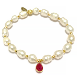 Freshwater pearl bracelet with margenta agate pendant. Pearls in shades of white and gold, with a red agate pendant.