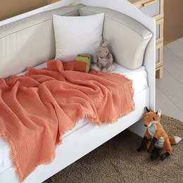 Soft, peach-colored muslin baby burp cloth measuring 80x80cm. Made of high-quality cotton material with a textured, crinkled design. Ideal for catching spit-up and keeping baby comfortable.